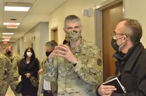 Colonel Vincent B. Myers, commander, U.S. Army Medical Department Activity-Fort Campbell and Blanchfield Army Community Hospital, in discussion with Douglas Adams, Daniel F. Flowers Professor of Civil and Environmental Engineering. (Ethan Steinquest, Fort Campbell Courier)