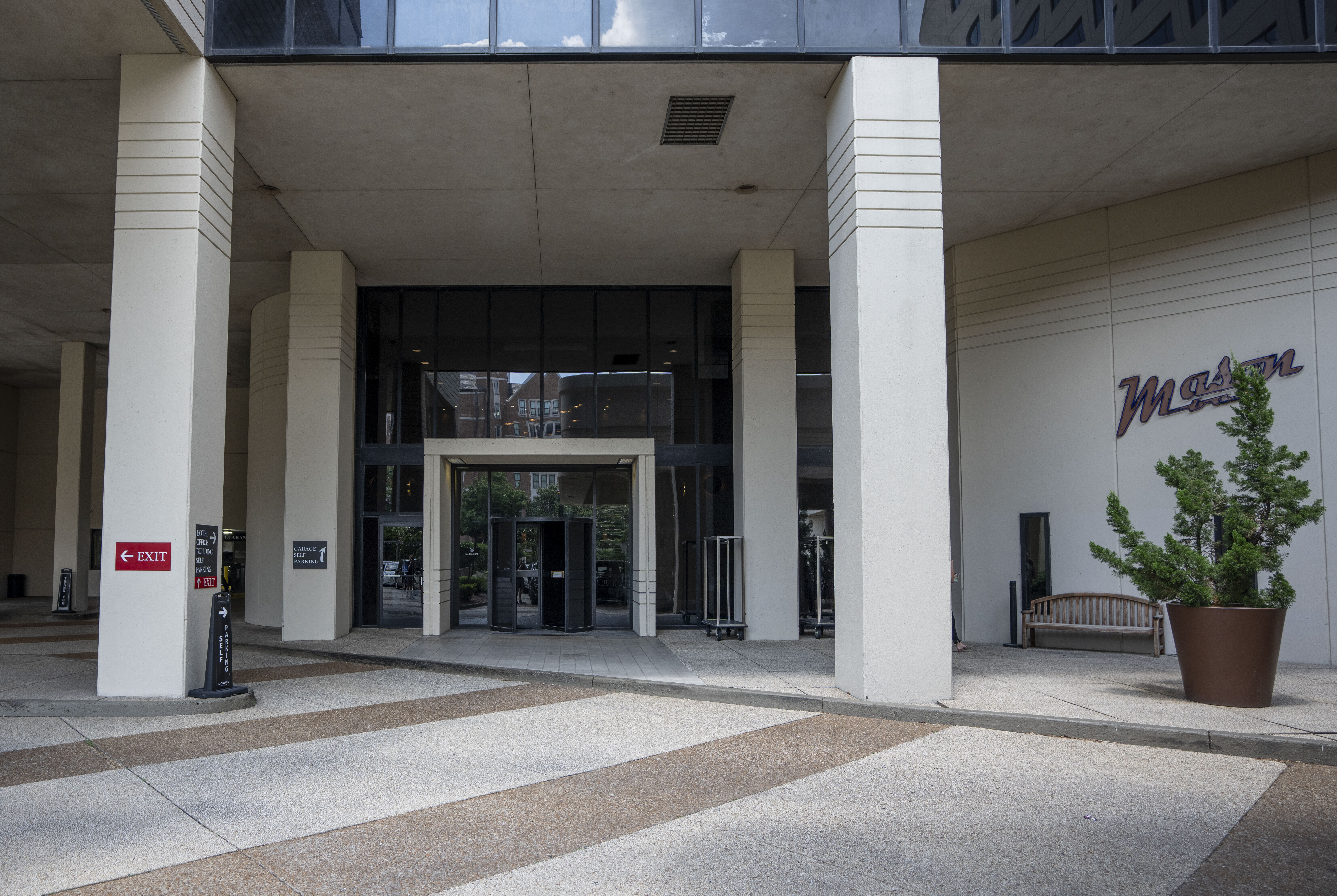 Enter the Loews Office Tower through revolving door to left of main hotel entrance