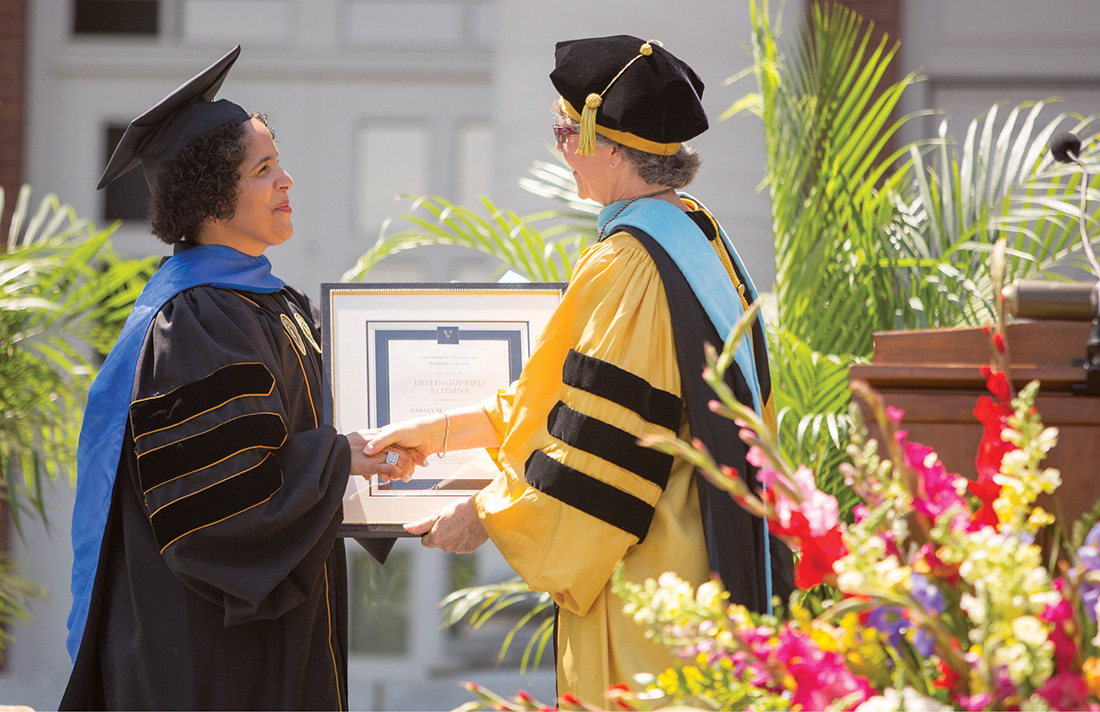 Camilla P. Benbow, right, the Patricia and Rodes Hart Dean of Peabody College of education and human development, presents Collado with the college’s 2015 Distinguished Alumna Award at Commencement. “My experience at Peabody College was transformative,” Collado said during her remarks. “It’s where I found my home and my center as I took intellectual, social and cultural risks. Peabody encouraged me to stretch inside myself and out in the world in ways that deeply informed my life’s work and personal journey.” (DANIEL DUBOIS)