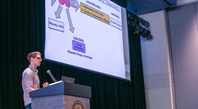 Brandon Baer, a postdoctoral fellow in the Bastarache lab, presents research during a lightning talk at the 16th annual VPA symposium.