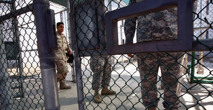 soldiers guarding gate at Guantanamo Bay