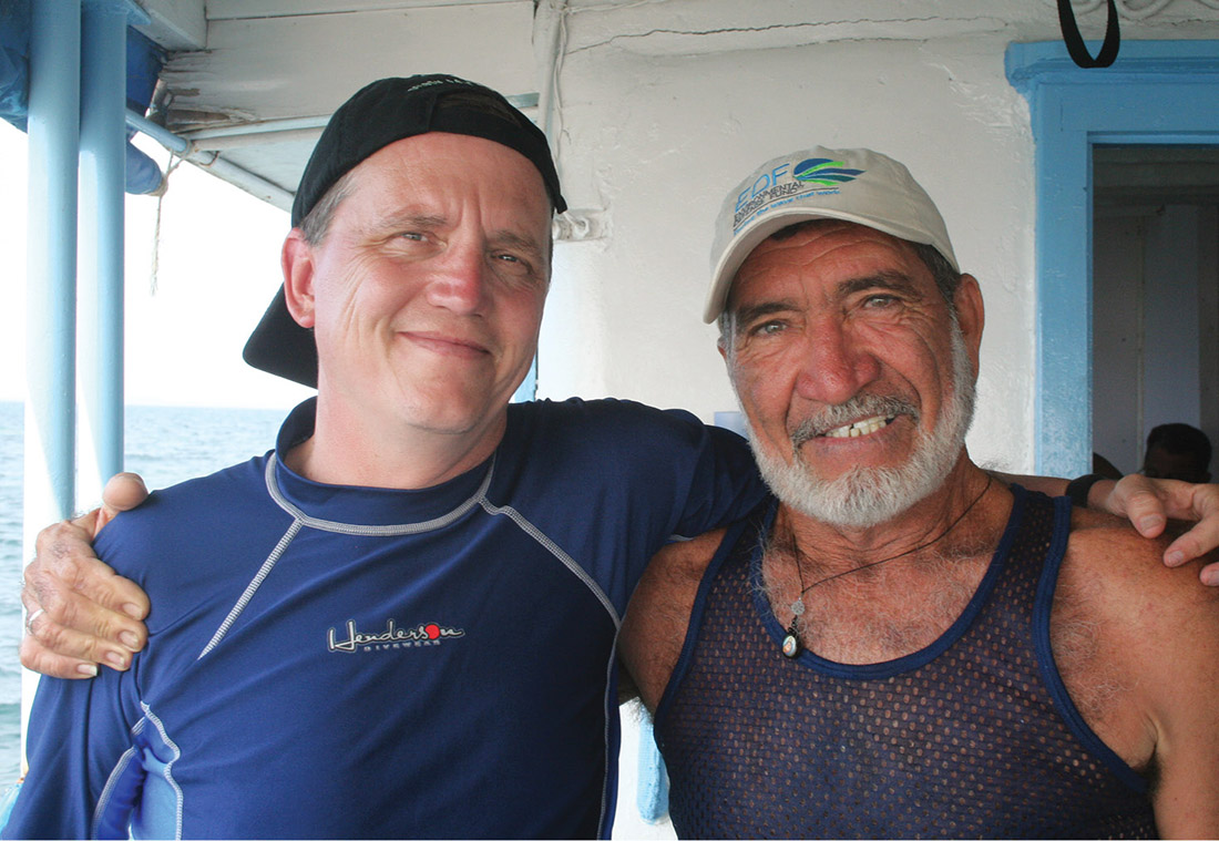 Whittle, left, joins Capt. Mariel Hechavarria Casas on a Cuban research vessel as part of a “floating workshop” bringing together Cuban, American and Mexican fishermen, scientists and government officials to discuss how to end overfishing and protect marine habitats. (ENVIRONMENTAL DEFENSE FUND)