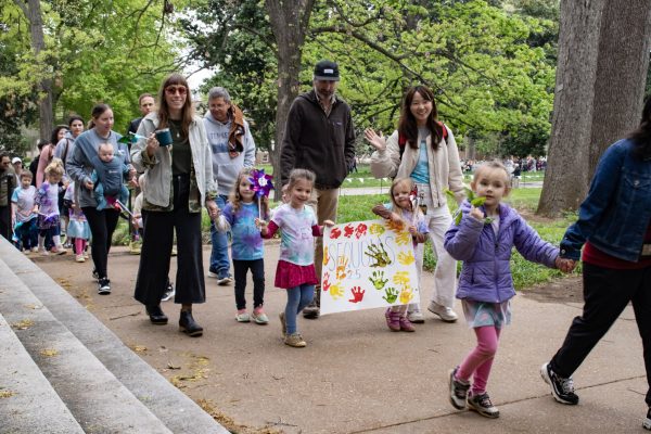 The Acorn School students and their families parade around Magnolia Lawn