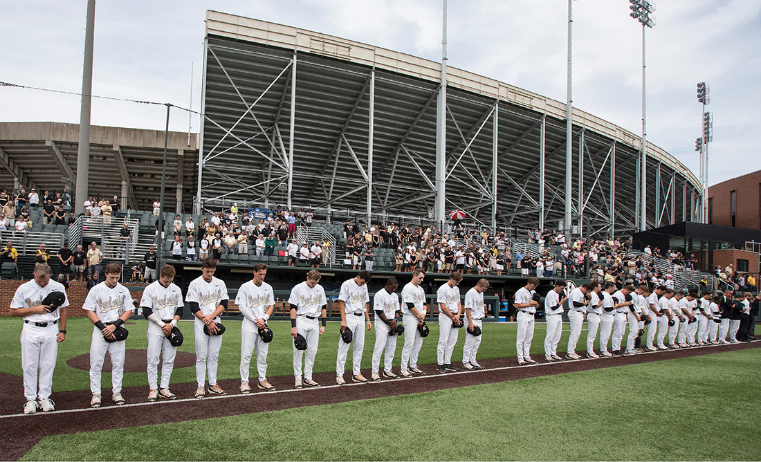 The Commodores honor Donny Everett’s memory June 4 on Hawkins Field at the NCAA Regional game against Xavier, the first game played after Everett’s death. The empty space in the players’ lineup represented their missing teammate. (JOE HOWELL)