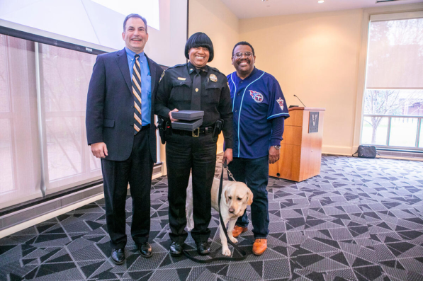 The Vice Chancellor for Administration established an annual divisional awards program to celebrate staff members for excellence in service, dedication to community values, and exceptional performance. (L-R: Eric Kopstain, Shaneithia Lewis, Corporal Jack, August Washington)