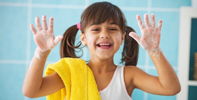 little girl washing hands