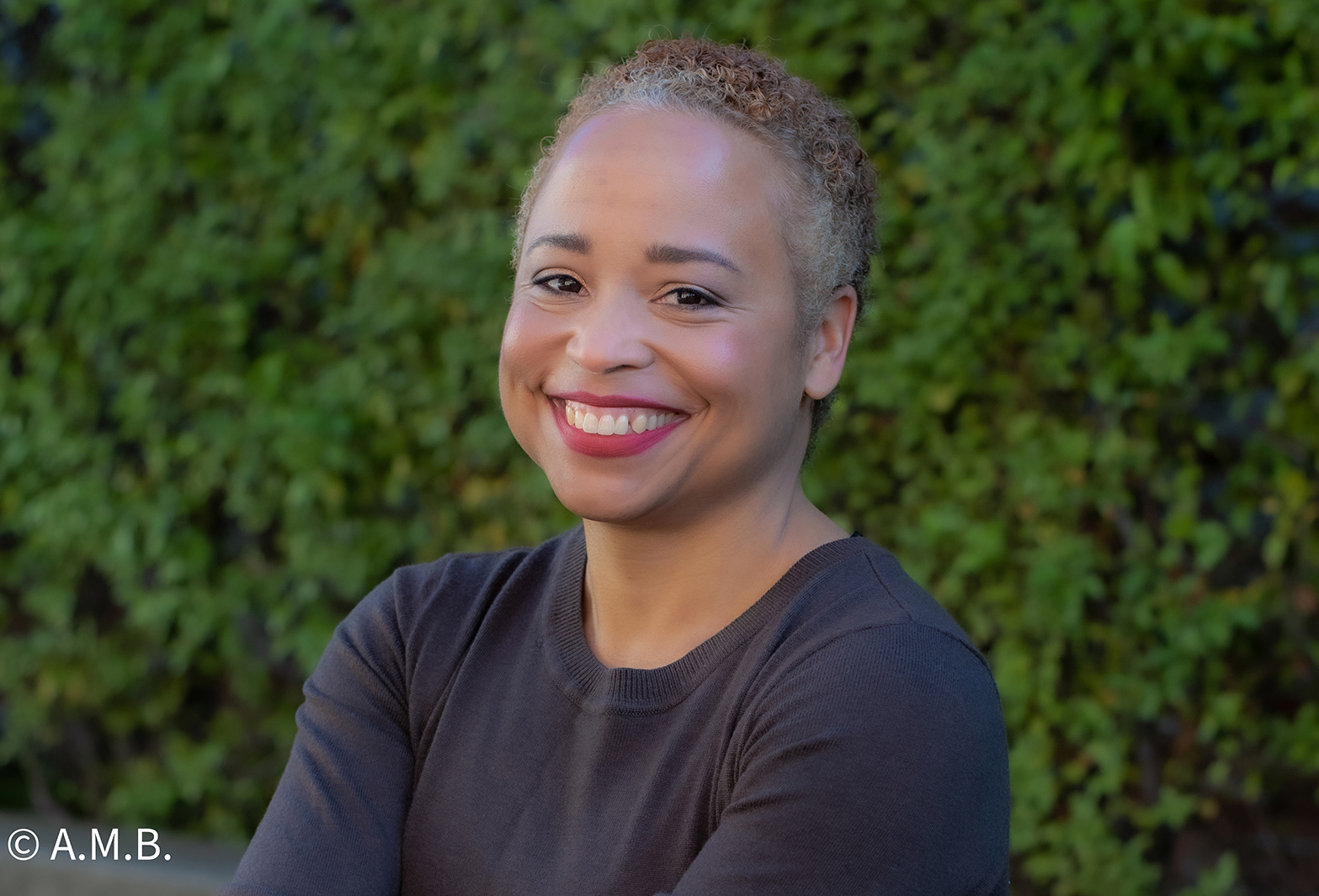 Portrait of Angela Boutté against greenery