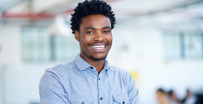 Young professionally dressed black man or college student