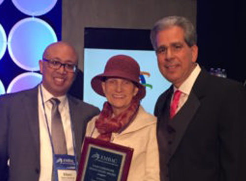 The Owen School's Tami Fassinger (center) with Elmer Almachar (left) and Michael Desiderio (right) of the Executive MBA Council.