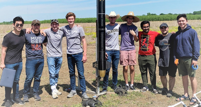 Vanderbilt Rocket Team members (L-R) Will Wu, Nick Pierce, Ryan Burinescu, Jon Marchineck, Will Reisner, Cameron Schepner, Alif Emazuddin, Ali Kilic and Alex Stevens in front of their Phoenix Rocket prior to lift off in Shelby Park, Memphis, on May 1, 2021.