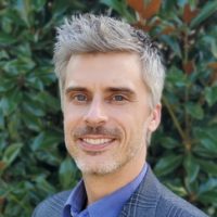 Man in blue blazer and dress shirt