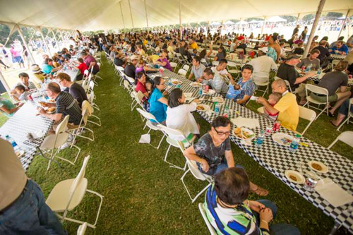 Employees and their family members were treated to free food from Famous Dave's at the 2015 football tailgate.