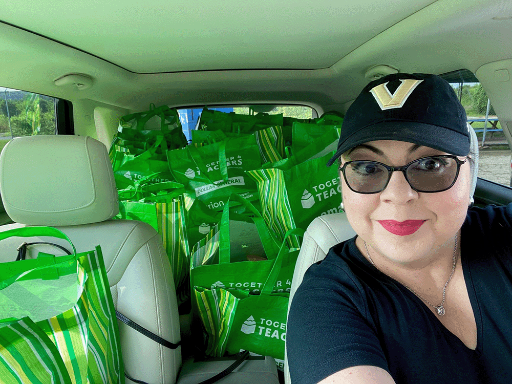 Elizabeth Bumpas prepares to deliver school supply bags