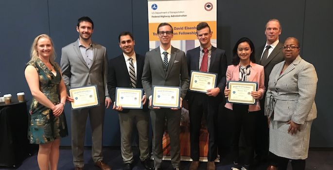 group portrait of winners holding award certificates