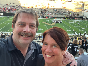 David Baughman and his wife at a Vanderbilt football game.