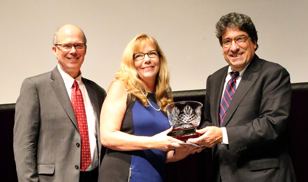 Chancellor Nicholas S. Zeppos (right) recognizes Commodore Award winner Judy Brandon (center) at the Employee Service Celebration Sept. 29, along with Associate Provost and Dean of Students Mark Bandas (left).