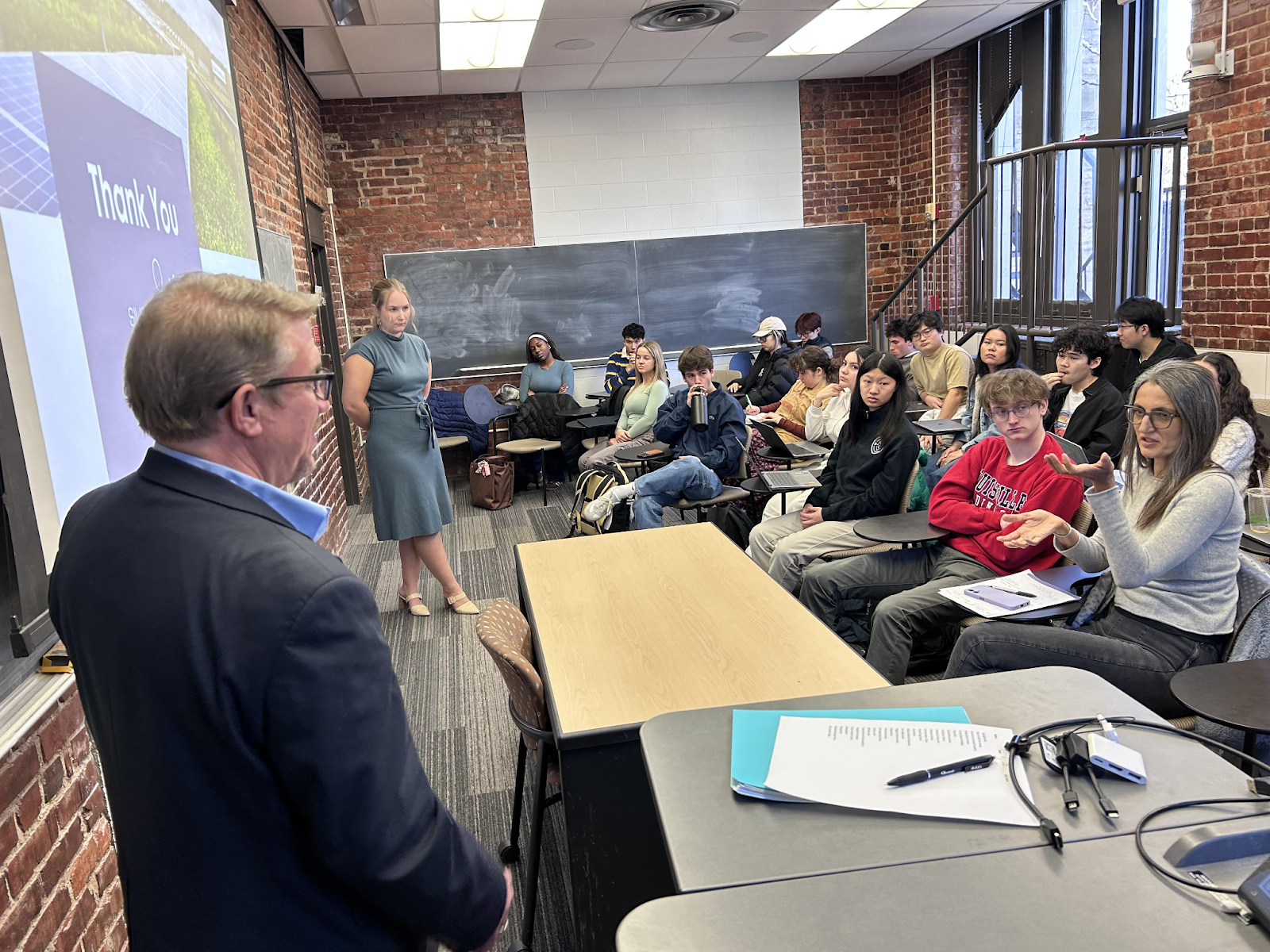 Bob Corney, co-founder and chief operating officer of Clearloop, and Karina Rovey, senior community partnerships associate, speak with students in the SOC3316 class.