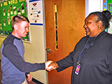 nurse introducing himself to school staff member