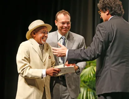 Melvin Fitzgerald (left), who works in the Department of Biochemistry, was recognized for his 55 years of service to Vanderbilt by Chancellor Nicholas S. Zeppos (right) and Vice Chancellor for Health Affairs Jeff Balser (center) at the Employee Awards Celebration Sept. 10. (Daniel Dubois/Vanderbilt)