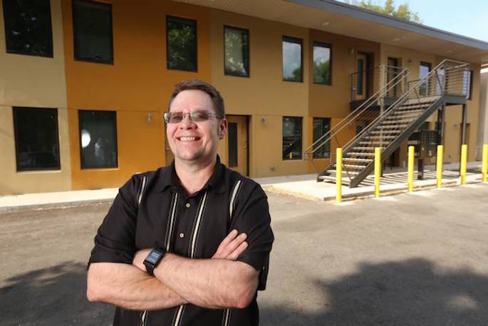 Jaco in front of apartment building
