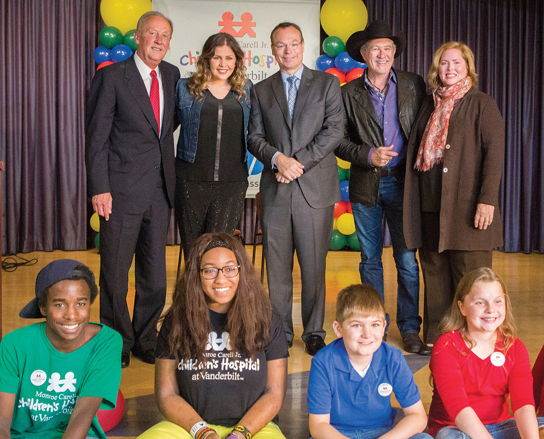 Celebrating the announcement of the CMA’s $3 million gift to Children’s Hospital are, standing, left to right, Frank Bumstead, MMgt’72, chair of the CMA Board of Directors; Hillary Scott of Lady Antebellum; Dr. Jeff Balser, MD’90, PhD’90, vice chancellor for health affairs and dean of Vanderbilt School of Medicine; Kix Brooks, board member for both the CMA and Children’s Hospital; and Kathryn Carell Brown, chair of Children’s Hospital’s “Growing to New Heights” campaign.