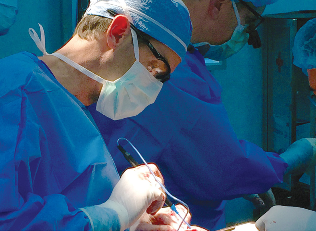 Snyder performs craniofacial surgery in Vietnam.