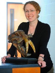 Larisa DeSantis with sabre tooth lion skull