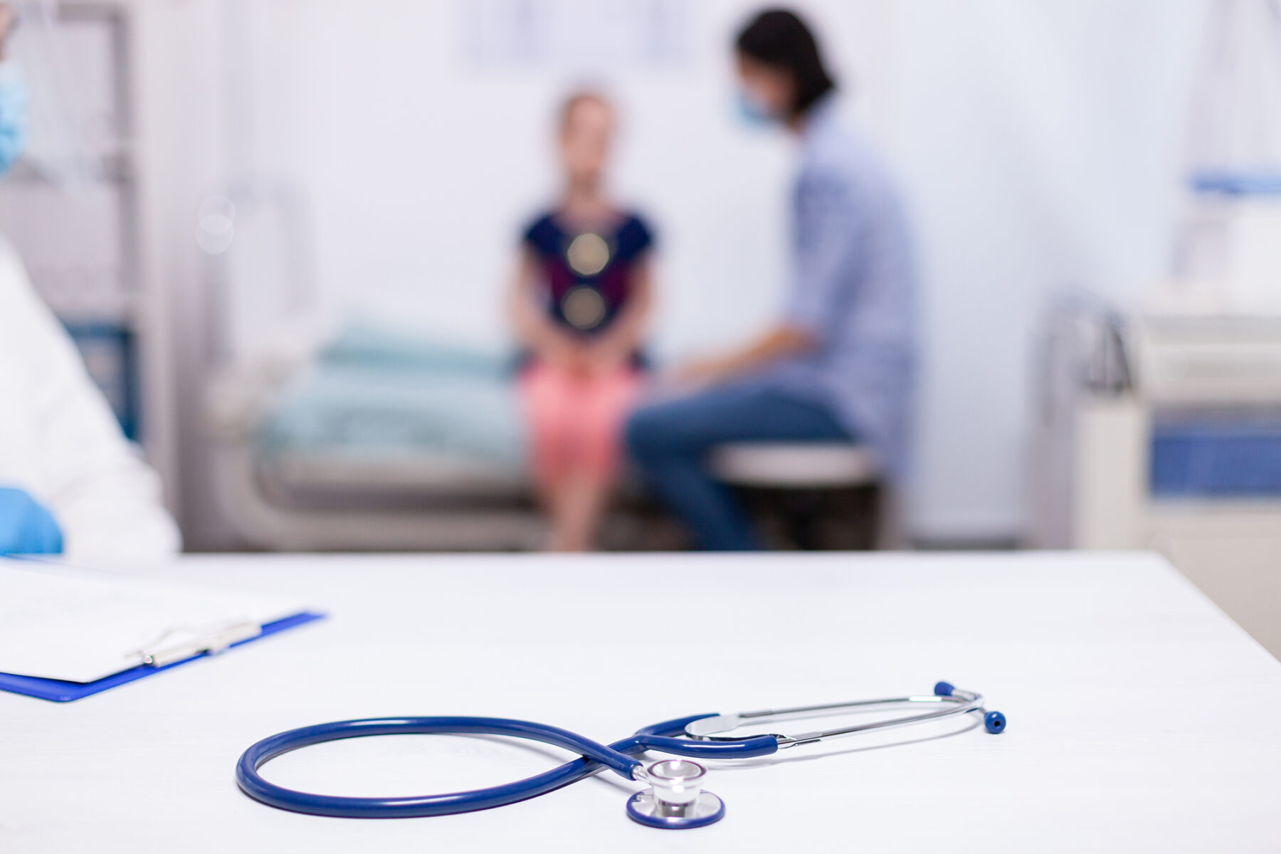 Closeup image of a stethoscope in a medical setting