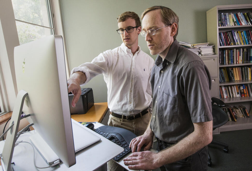 Eugene Vorobeychik, right, is a computational game theorist and researcher whose work includes studying election security and crime prevention. (Photo by Joe Howell)