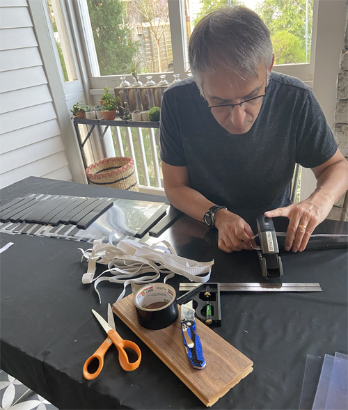 Mias Pretorius, MBChB, MSCI, chief of Cardiothoracic Anesthesiology at Vanderbilt University Medical Center (VUMC), models one of the face shields he and his family assembled to provide back-up personal protective equipment (PPE).