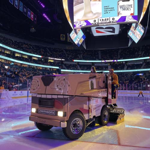 Child ambassador Grace Hamilton, 13, rides the Zamboni at the Nashville Predators Hockey Fights Cancer game Nov. 13.