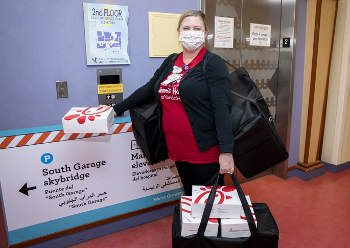 Maggie Brown, MBA, picks up some of the 600 meals donated by the Nashville Predators in partnership with Chik-Fil-A Predators.