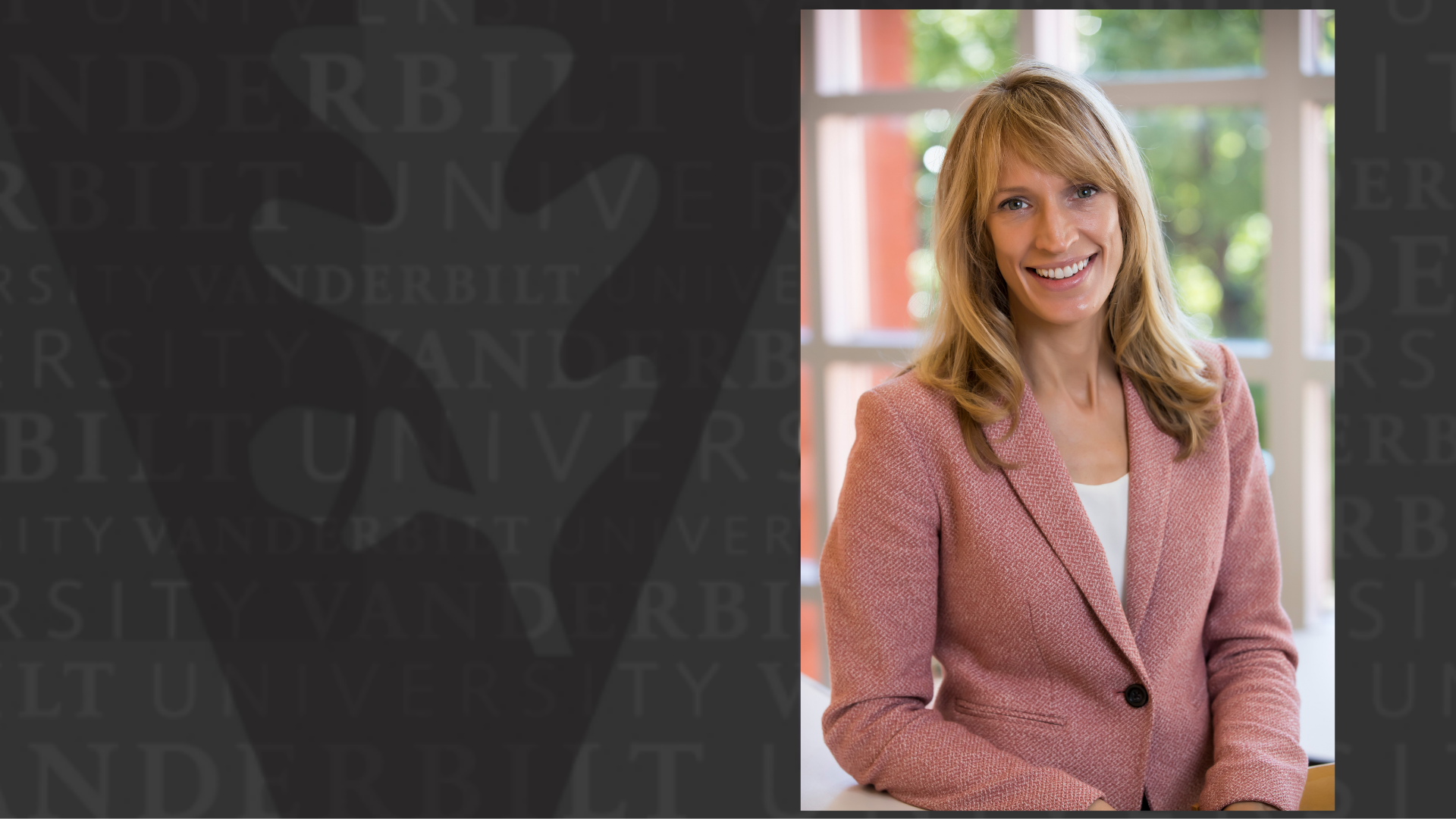 blonde woman in pink jacket