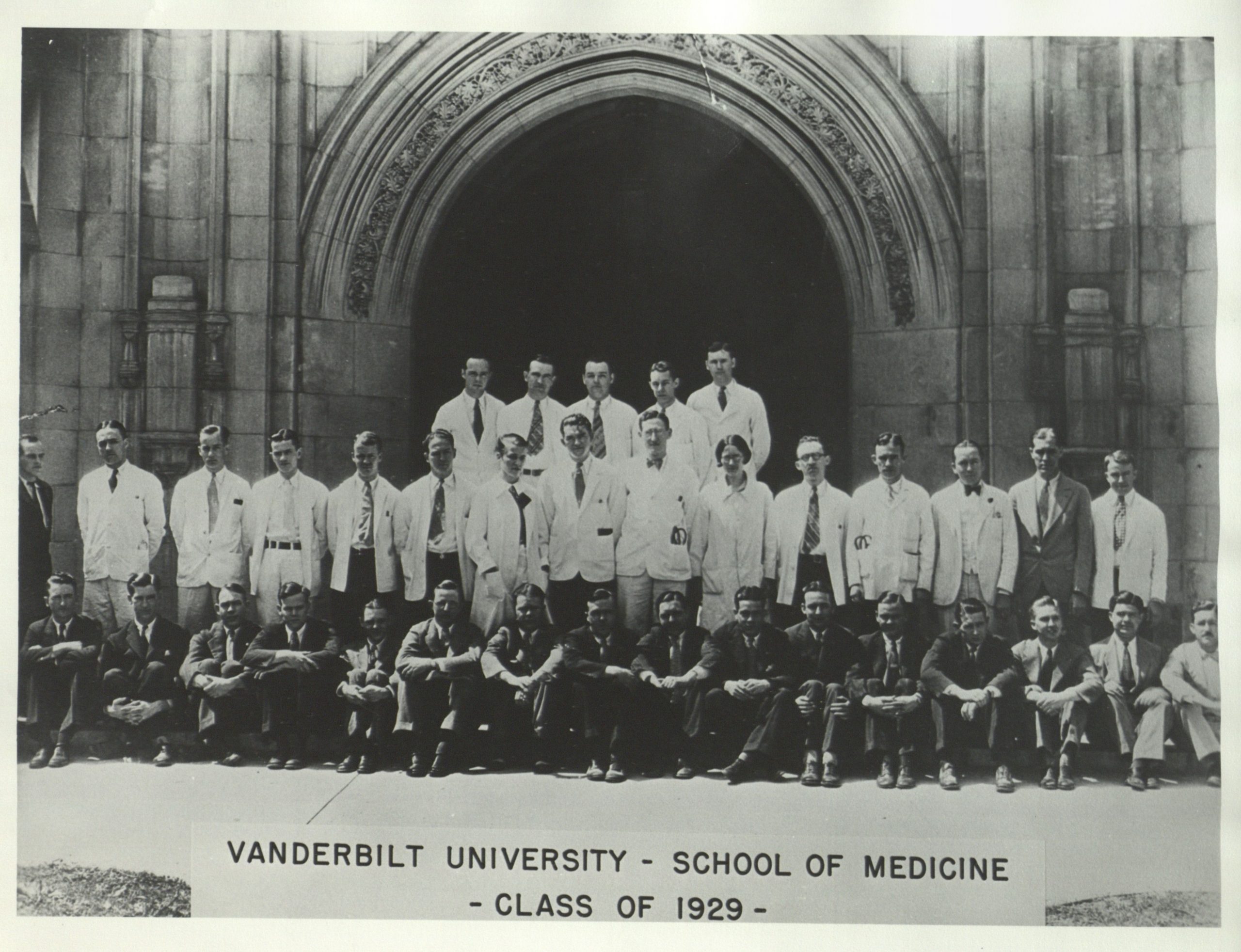 The VUSM class of 1929 gathers in their white coats.