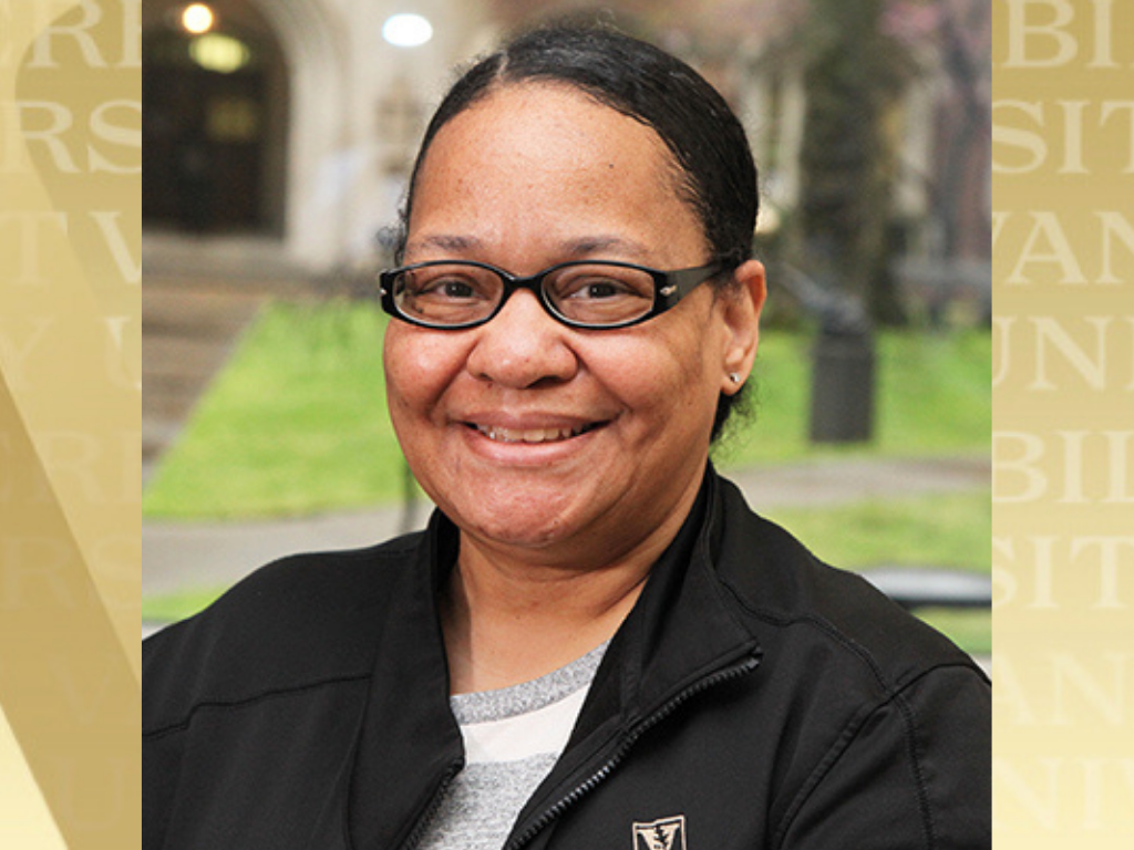 Roz Johnson headshot with Vanderbilt gold background