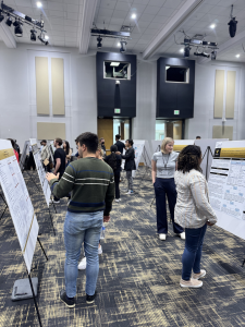 Attendees at the 2025 VIRAL research symposium poster session.