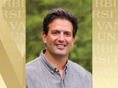 Jeff Spraggins headshot with gold VU background