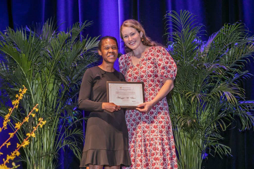 A dean presents an award