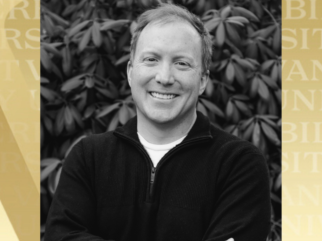 Walt Gall headshot with Vanderbilt gold background