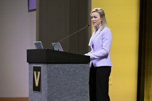 Katie Coate speaking at symposium honoring Alan Cherrington.