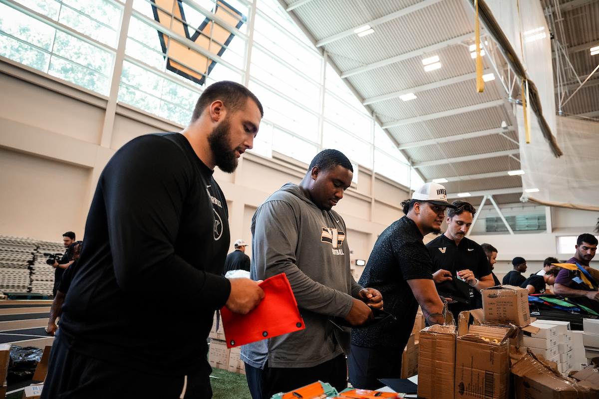 Vanderbilt student-athletes and staff volunteer with PENCIL on a backpack-stuffing project.