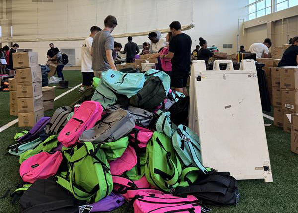 Vanderbilt student-athletes and staff volunteer with PENCIL on a backpack-stuffing project