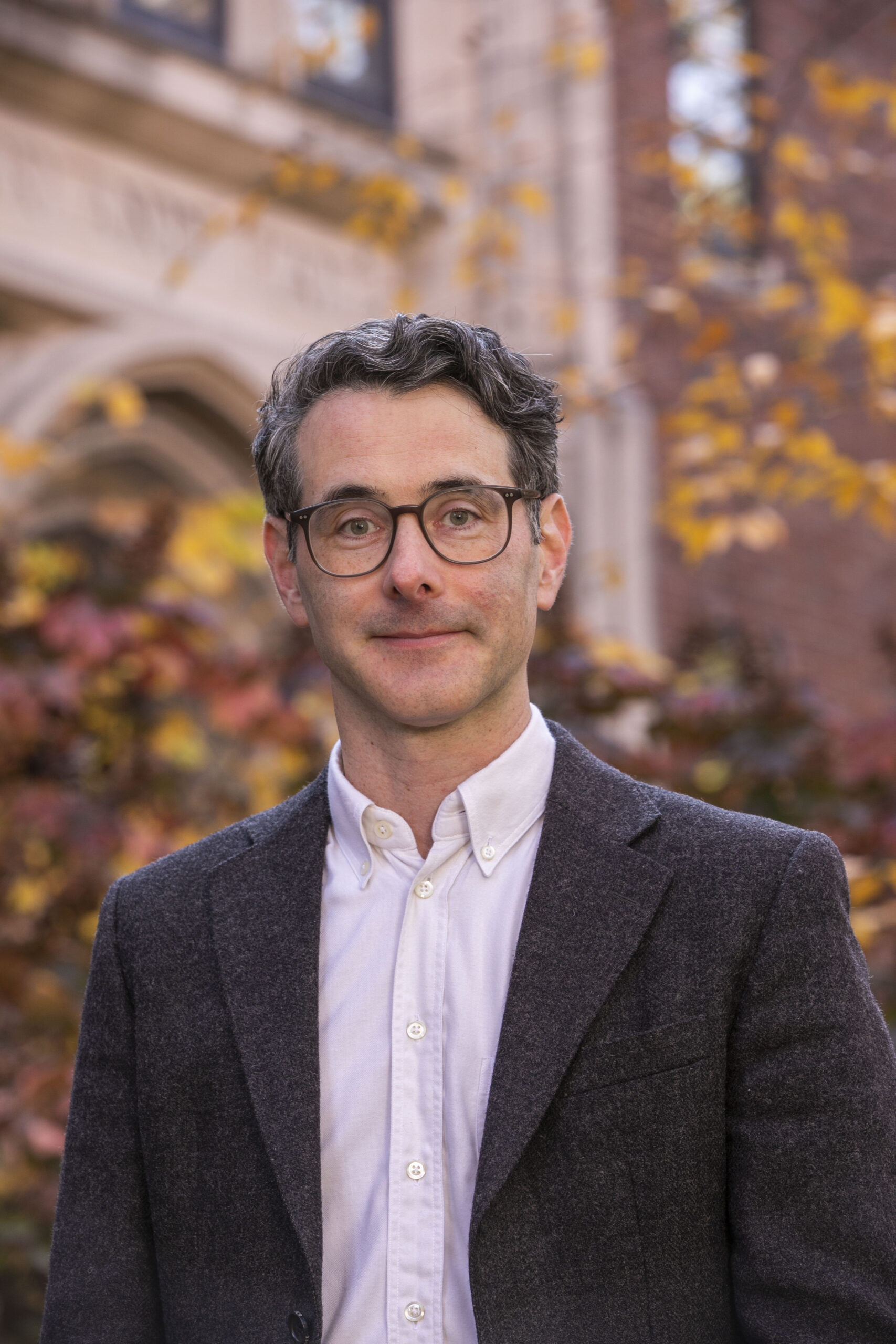 man standing in front of tree