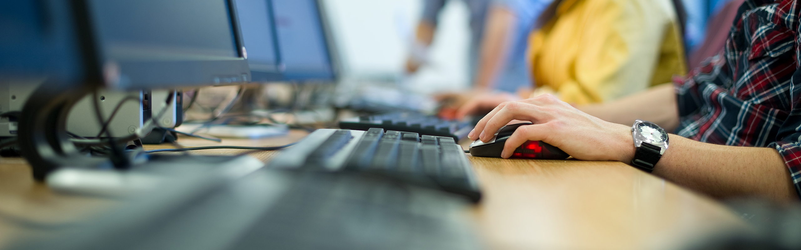 hands typing at a computer