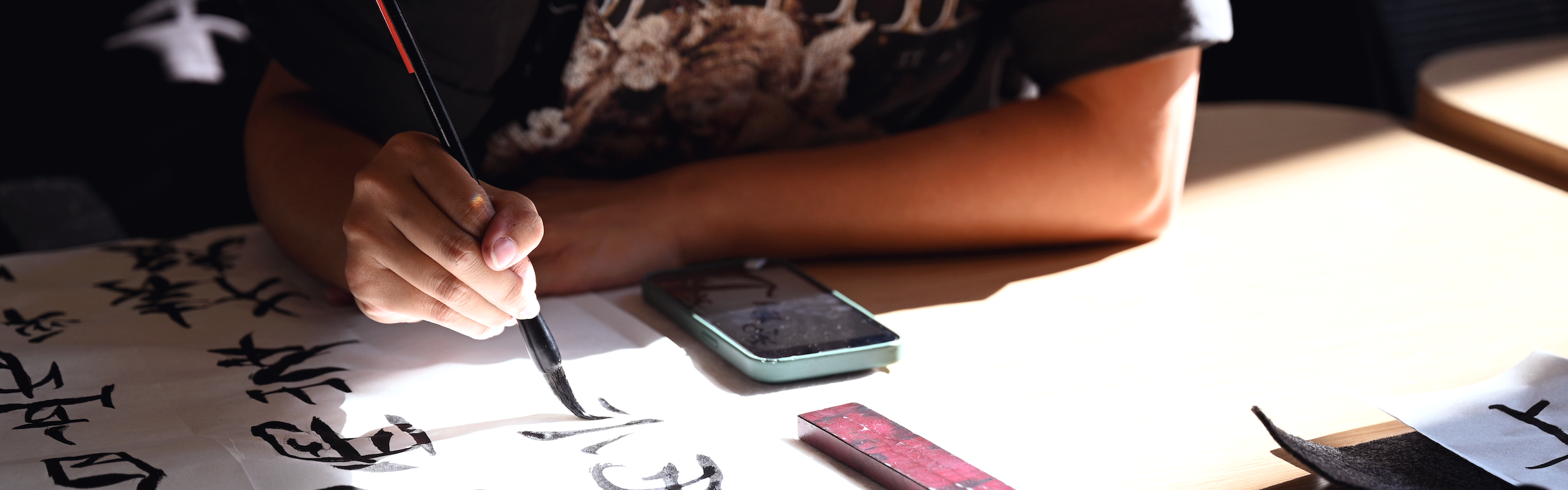 Close up of student writing caligraphy