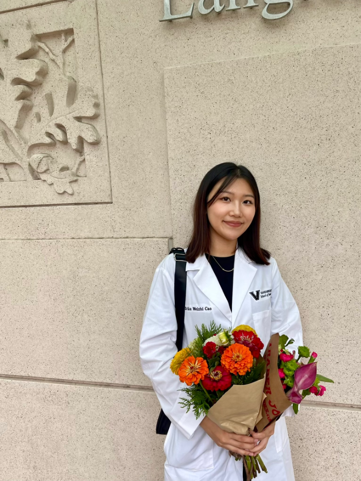 Photo of Erika holding bouquet of flowers