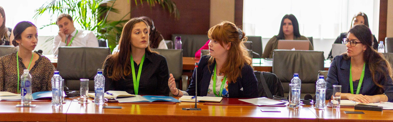 Public policy studies major Miranda Cross speaks at Young Diplomat Forum while other students listen