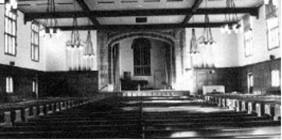 Black and white photo of an old auditorium.