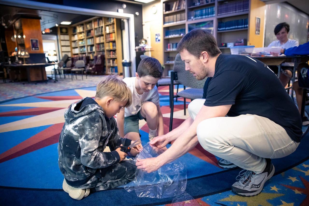 Dr. Billy Teets working with middle school students on an educational project at Dyer Observatory