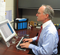 Principal at his computer